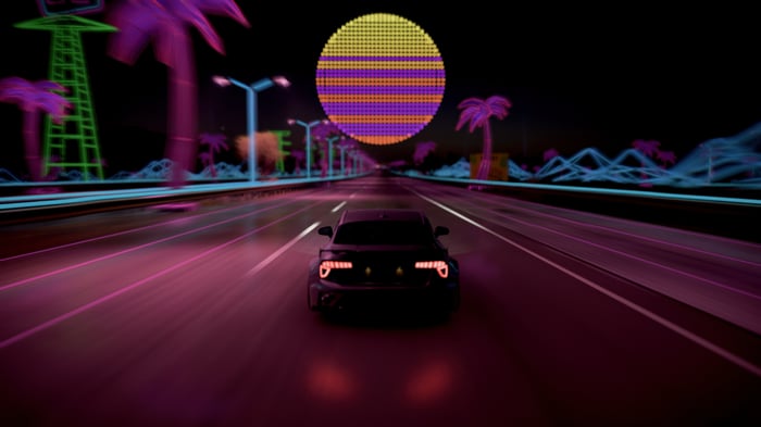 Car driving on a neon road at night