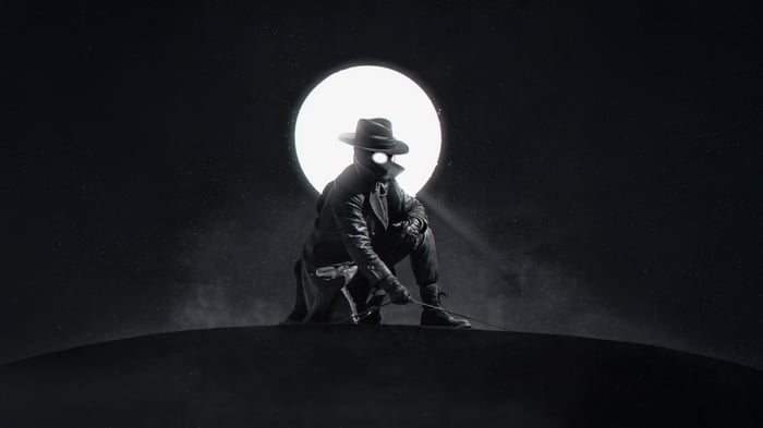 Spider-Man Noir in front of a large moon