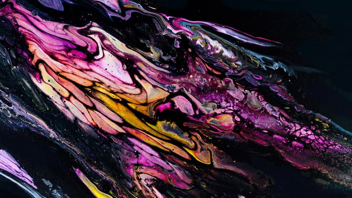Abstract fluid art with pink, yellow, and purple swirls