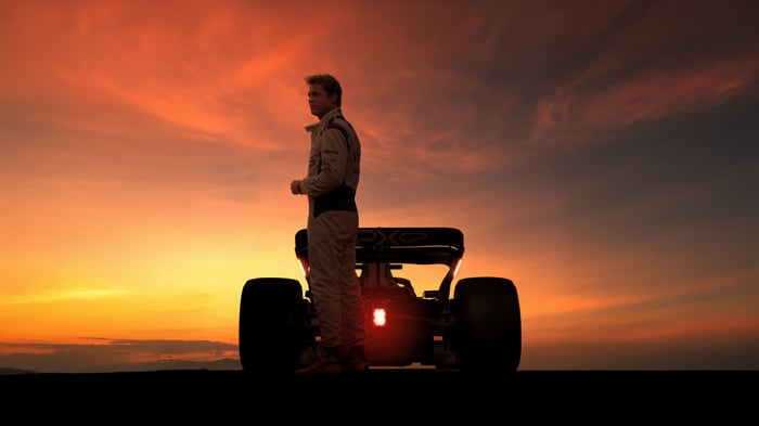 Formula 1 Movie: Racer and Car at Sunset