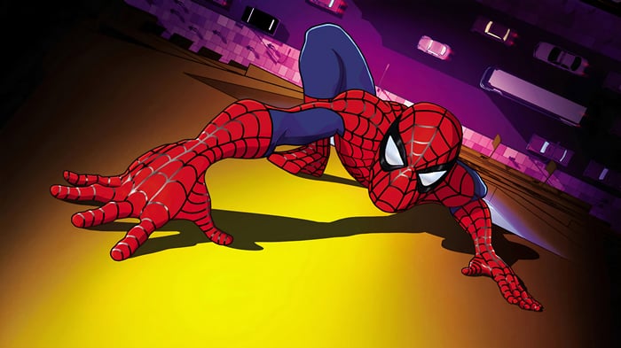 Spider-Man crawling on a building at night