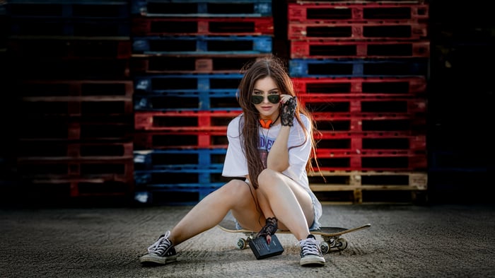 Girl with Toshiba Music Player on Skateboard