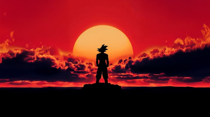 Goku Silhouette Against a Fiery Sunset