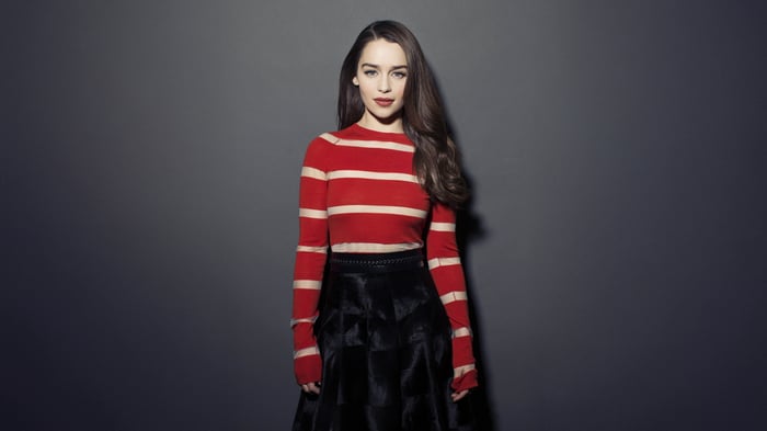 Emilia Clarke in red and white striped top and black skirt