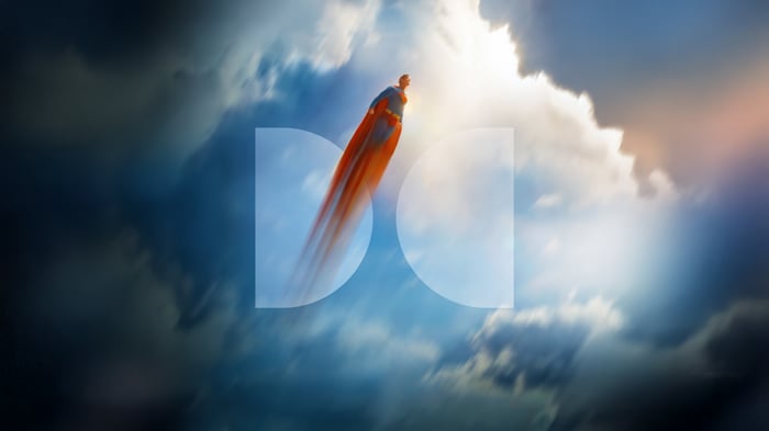 Superman flying through clouds with Dolby logo