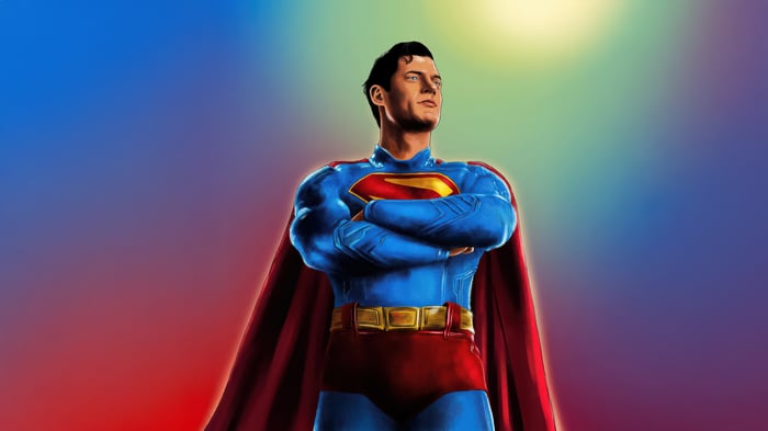 Superman with arms crossed against a colorful background