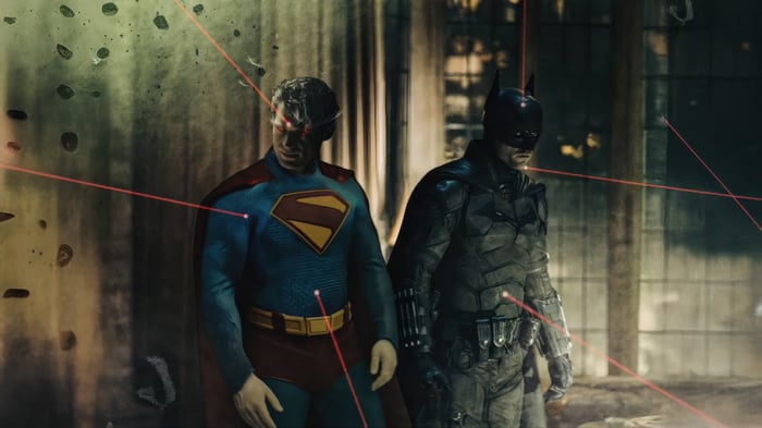 Batman and Superman with red laser beams