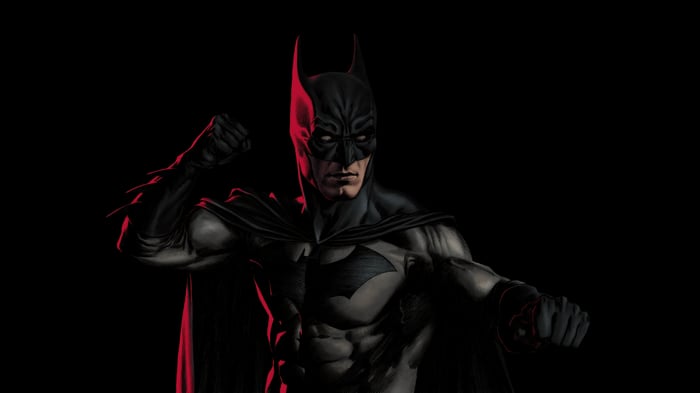 Batman in a fighting stance with red lighting