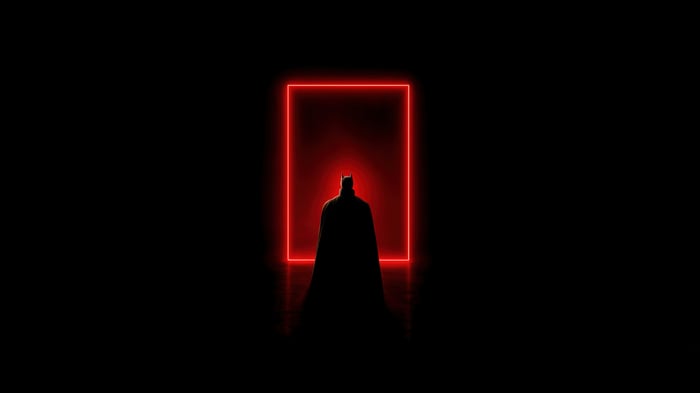 Batman standing in front of a red neon square