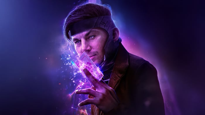 Gambit holding a glowing playing card