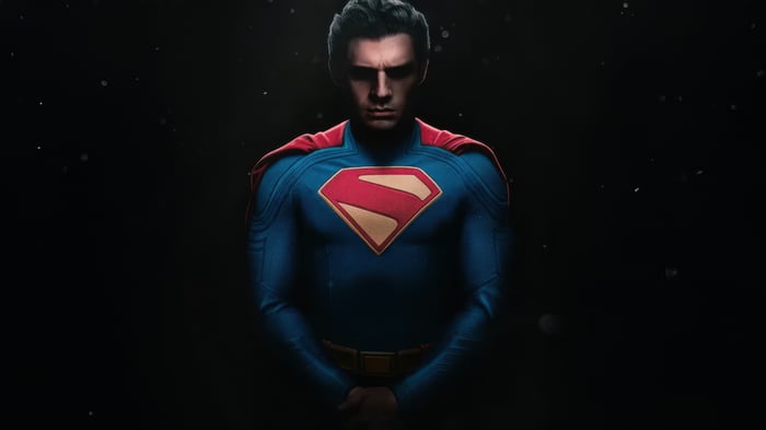 Superman in a blue and red suit with a cape