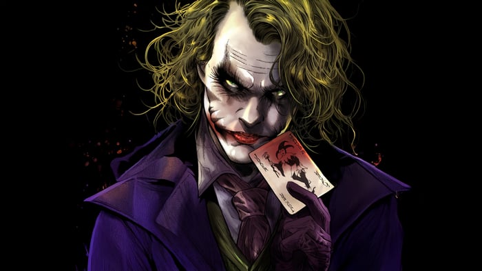 The Joker holding a Joker playing card