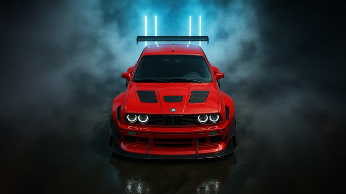 Red BMW M3 E30 with a large rear wing