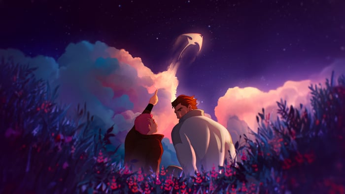 Two people watch a kite fly in the night sky