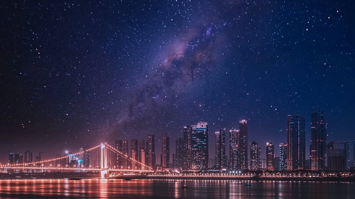 Cityscape with bridge under starry sky