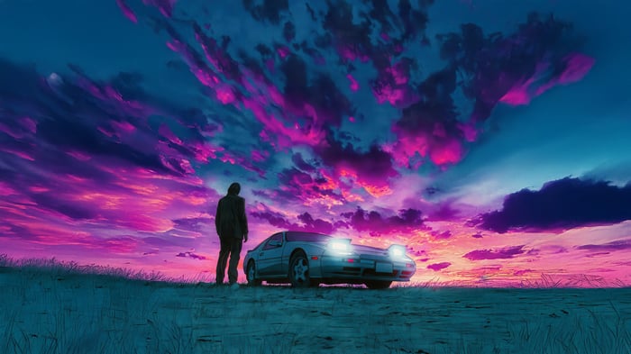 Person and car under a colorful sky