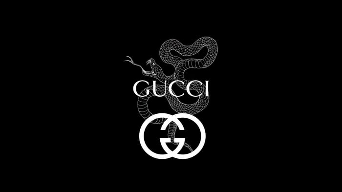 Gucci snake and logo on black background