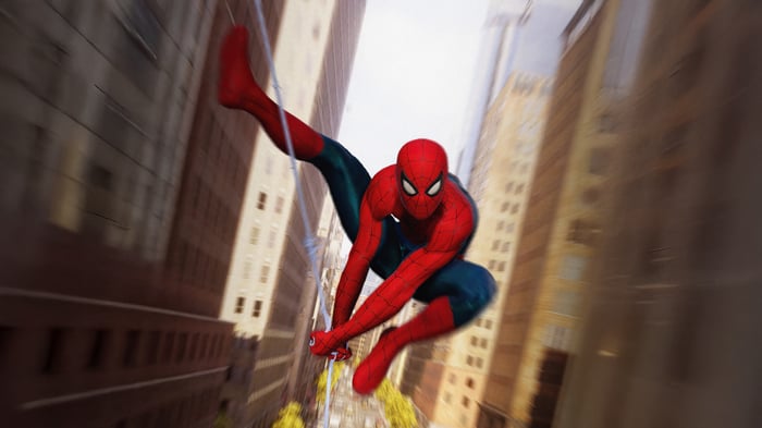 Spider-Man swings between city buildings