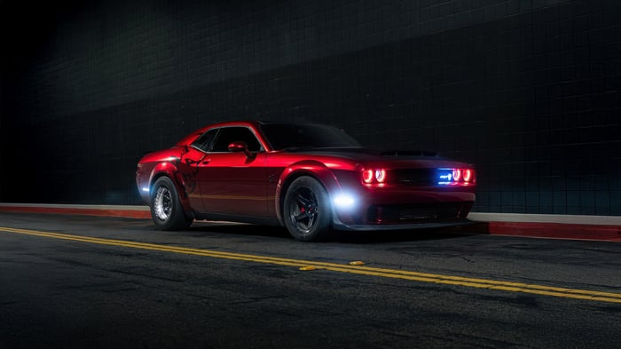 Red Dodge Challenger SRT on a dark street