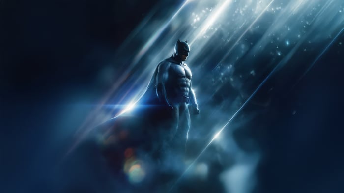 Batman standing in dramatic lighting