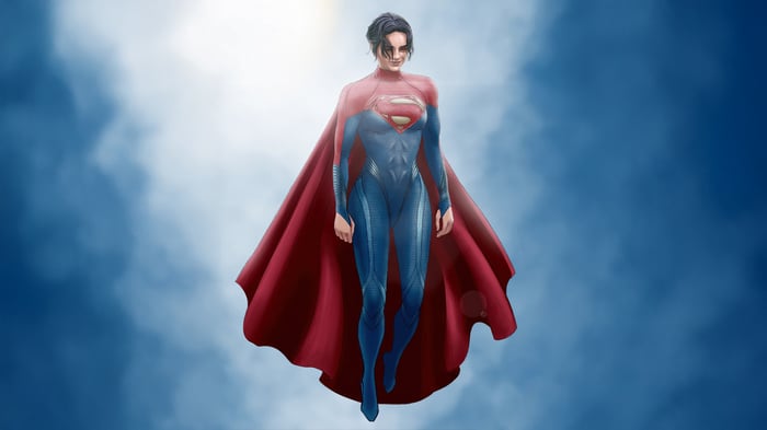 Supergirl in a blue suit with a red cape flying