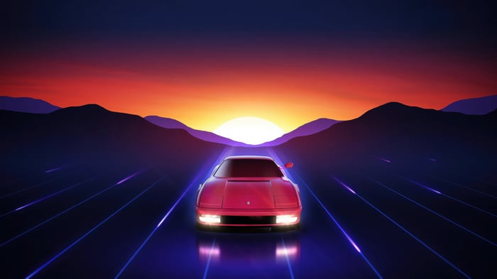 Red Ferrari Testarossa Driving Towards Sunrise