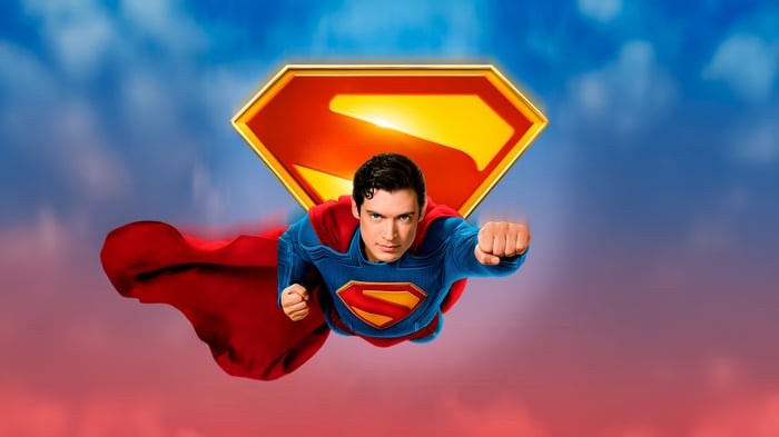 Superman flying with his logo in the sky