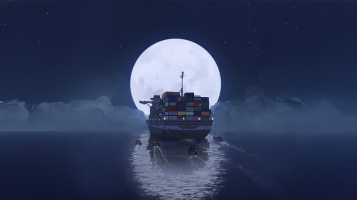 Container ship sailing under a large moon at night
