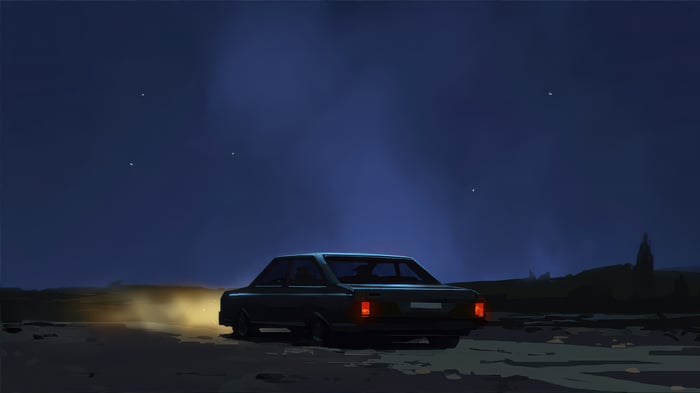 Car driving at night under starry sky