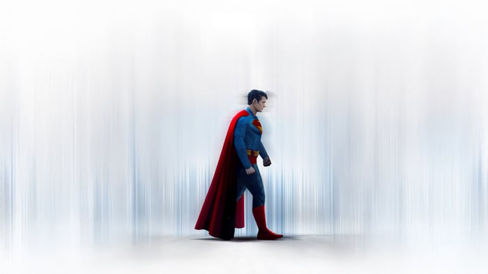 Superman in a blue suit with a red cape