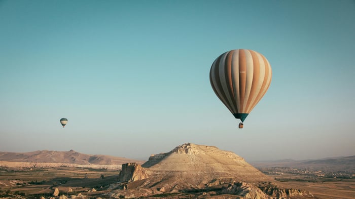 Hot Air Balloons Over Desert Landscape