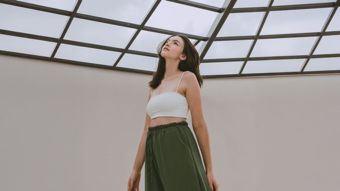 Girl looking up under a glass ceiling