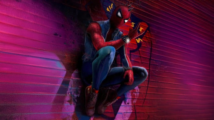 Spider-Punk sitting on a wall with graffiti