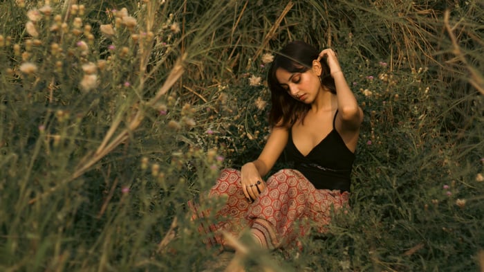 Girl in black in a wildflower field