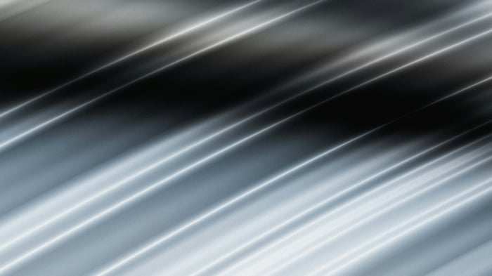 Abstract liquid glass texture with diagonal light streaks