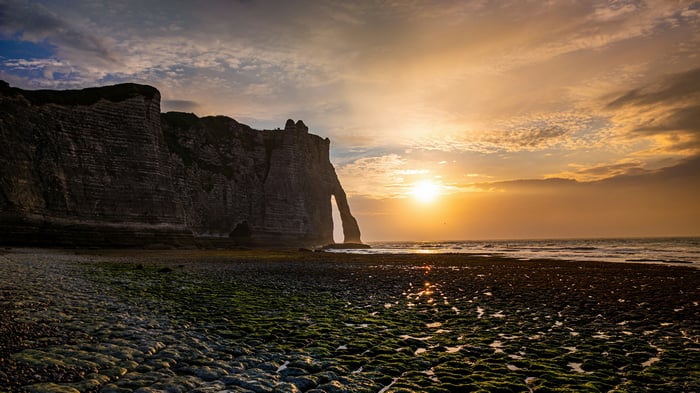 Golden Sunset Through Natural Stone Arch at Etretat