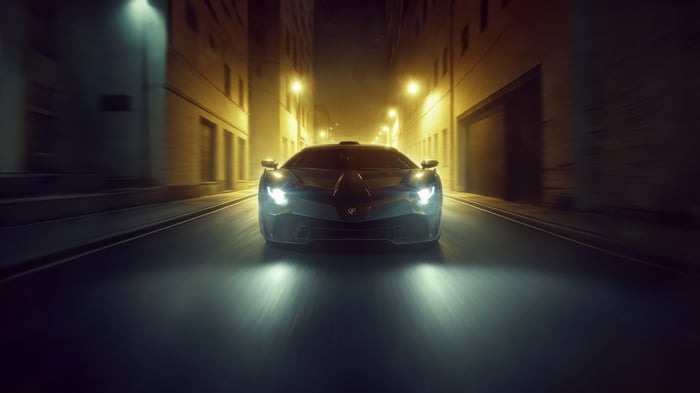 Lamborghini SC18 driving through a city at night