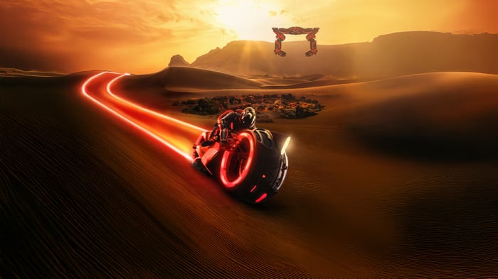Tron Ares Lightcycle Blazing Across Sand Dunes