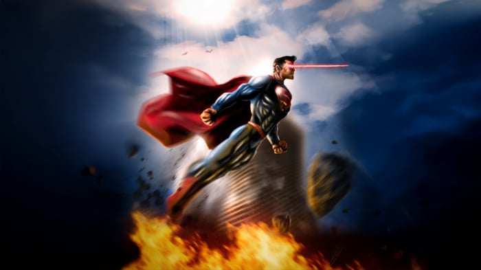 Superman firing heat vision over a burning city