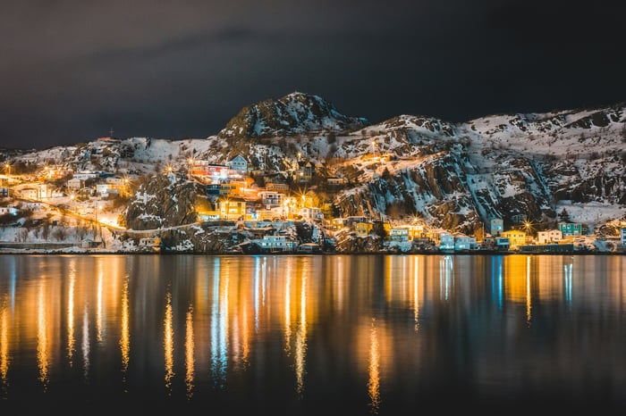 City lights on a snowy mountain at night