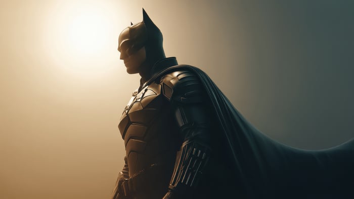 Batman in his suit with cape