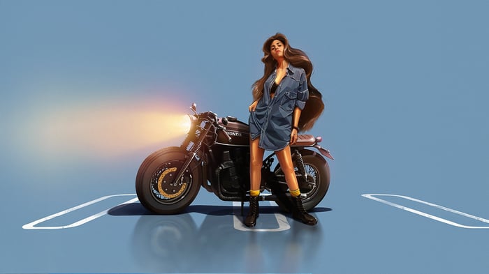 Woman in denim shirt with Honda motorcycle