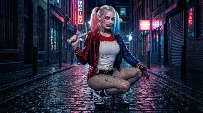 Harley Quinn with a baseball bat in a neon alley