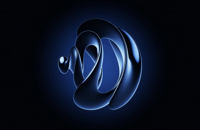 Metallic Abstract Sculpture on Dark Blue Background
