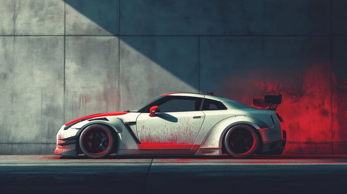 White Nissan GTR with red accents and red smoke