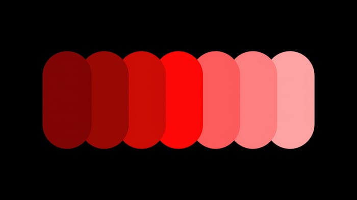 Minimalist gradient of red ellipses on black background