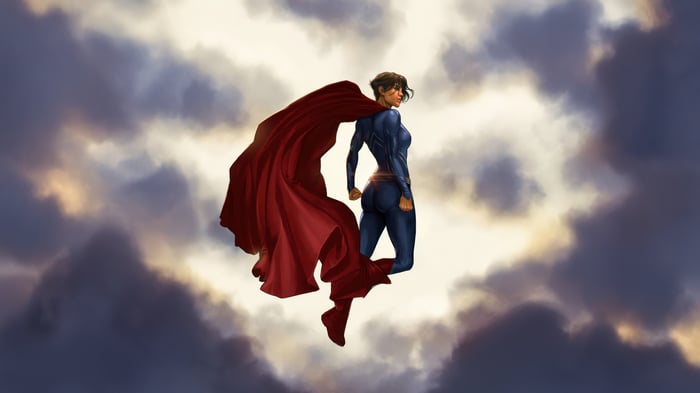 Supergirl in a blue suit with a red cape flying