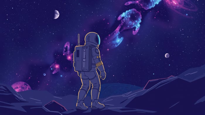 Astronaut on a rocky planet looking at nebulae