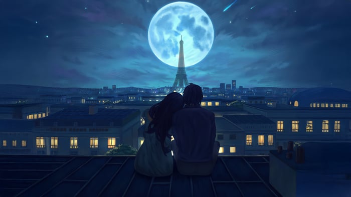 Couple watches the Eiffel Tower under a full moon