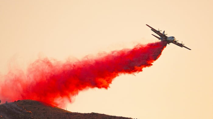 C-130 Hercules drops retardant on a wildfire